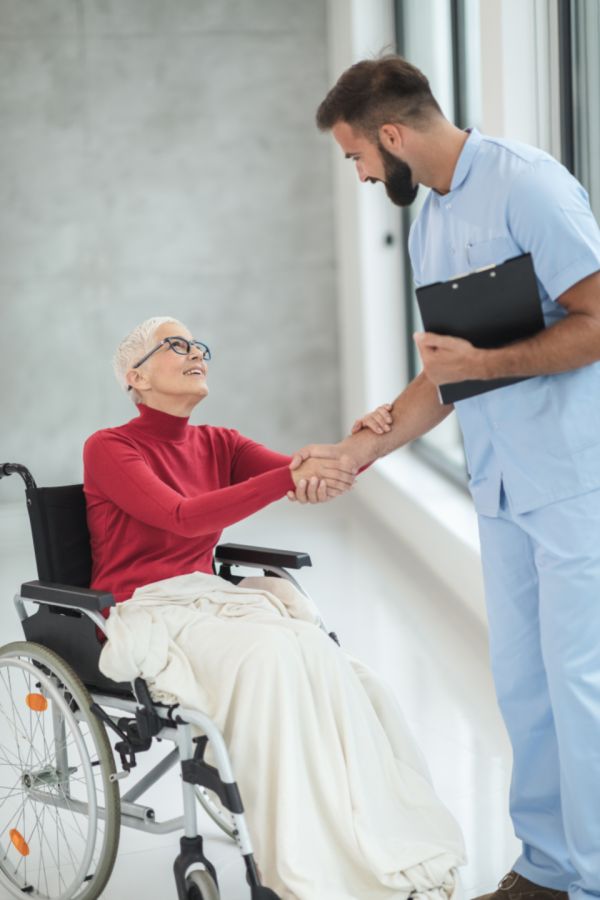 Caregiver welcoming a resident