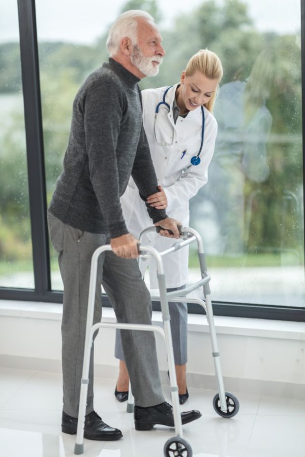 Caregiver supporting a resident at Evergreen Senior Living