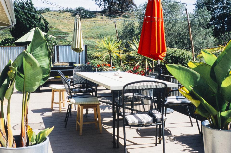 Landscaped backyard with patio and greenery