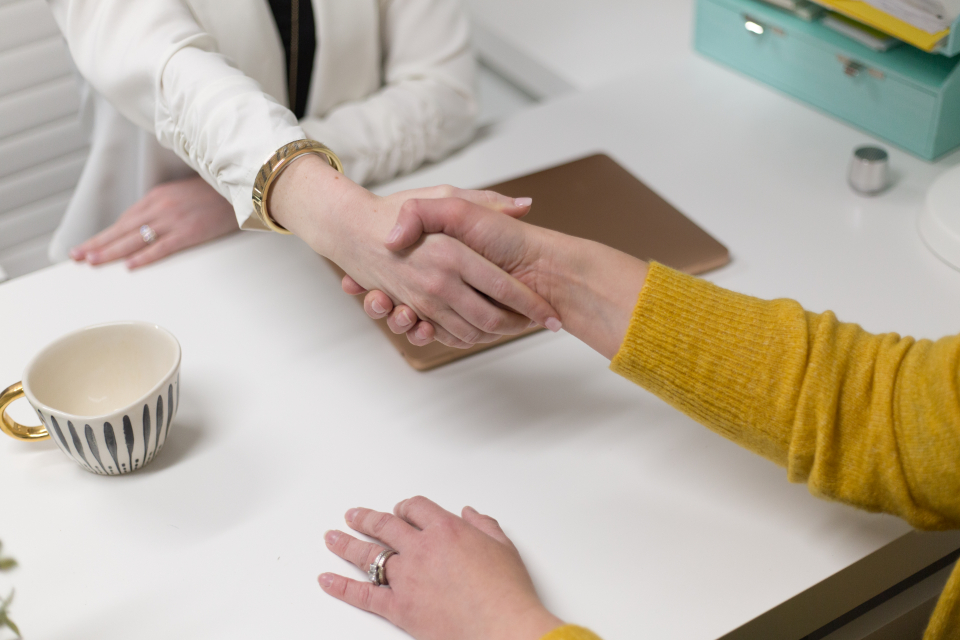 Attorney shaking hands with client